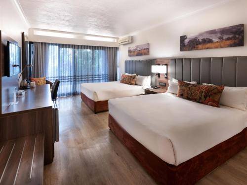 Katil atau katil-katil dalam bilik di ANEW Hotel Hluhluwe