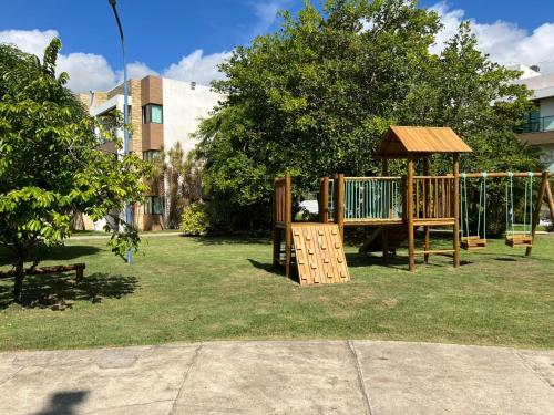 a playground in a park with a gazebo at Apartamento na Barra de São Miguel in Barra de São Miguel