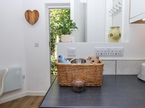 a kitchen with a basket on a counter at The Workshop in Tavistock