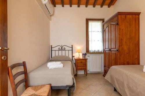 Ένα ή περισσότερα κρεβάτια σε δωμάτιο στο Borgo San Carlo