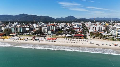an aerial view of a beach in a city at iG Pousada - Frente Mar in Florianópolis