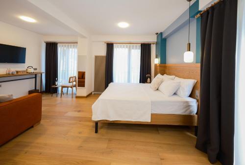 a hotel room with a bed and a desk at Pastel İstanbul in Istanbul