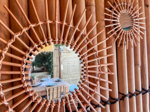 a mirror on a wall with a table in a room at Appartement de Standing Bali 2 Chambres, Terrasse, Wifi, Hyper-Centre Toulon in Toulon