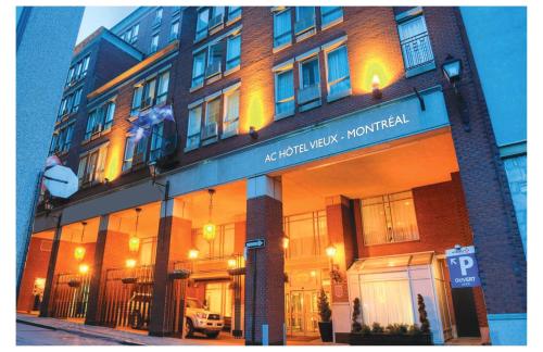 a building with a sign on the front of it at AC Hotel by Marriott Old Montreal in Montréal