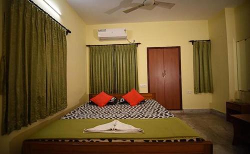 Ένα ή περισσότερα κρεβάτια σε δωμάτιο στο FabHotel Sonar Bangla Guest House