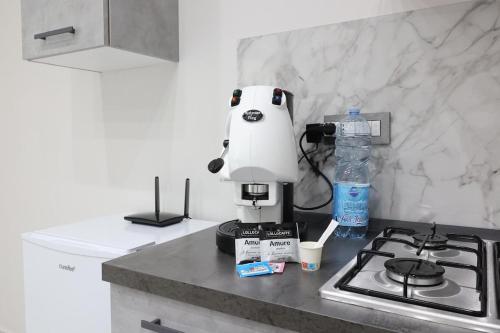 a coffee maker sitting on a counter in a kitchen at Il bacio del sole in Casola di Napoli