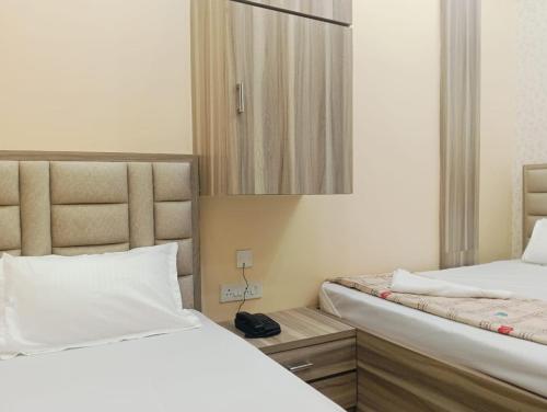 Katil atau katil-katil dalam bilik di Marquis Luxe Guest House