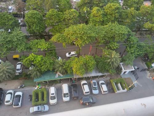 an aerial view of a parking lot with cars at Hotel Royal King in Lucknow