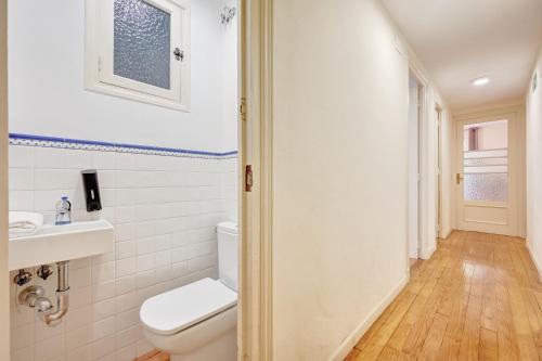 a bathroom with a toilet and a sink at Tejería 20 by Clabao in Pamplona