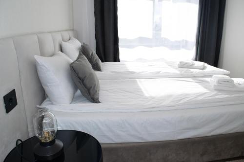 Postel nebo postele na pokoji v ubytování Modena Resort Spa & Wellness Zlatibor