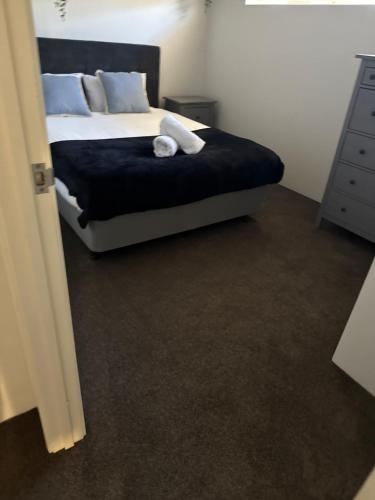 a bedroom with a bed and a dresser and a bed at Forrest River Escape on Evans, Star-link & 4 bed, Motel Style rooms in Collie