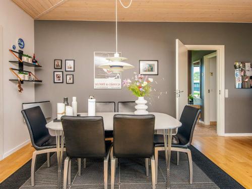 a dining room with a table and chairs at Exclusive Retreat with Spa - By Traum Ferienwohnungen in Rømø Kirkeby