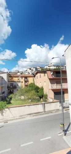 an empty street with buildings and a street light at Hotel Edelweiss in Laino Borgo