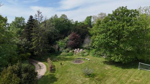 an overhead view of a garden with trees at Unique & Rural Child Friendly Annexe with Large Gardens, Games & Tennis Court - Chichester Holiday Properties in Chichester