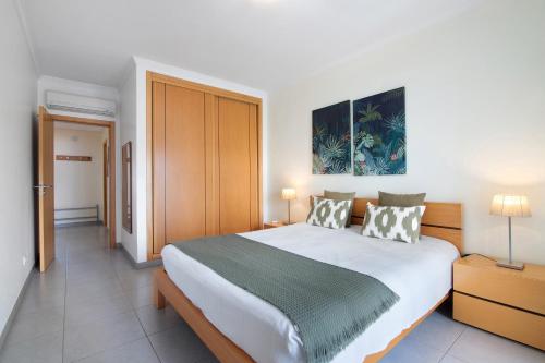 Ένα ή περισσότερα κρεβάτια σε δωμάτιο στο Quarteira Modern Flat