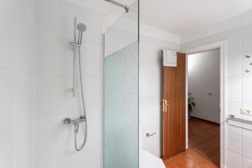 a bathroom with a shower with a glass door at Bonita Apto Nieves in Playa de Santiago