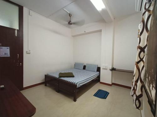 Cama o camas de una habitación en Aditya Residency