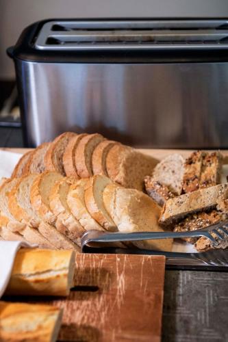 a loaf of bread sitting on a cutting board in an oven at International Hotel & Suite in San Benedetto del Tronto