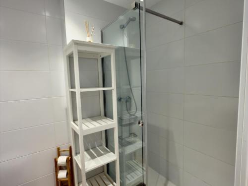 a bathroom with a shower with a glass door at Amenábar Ocean Suites by Staycare in Costa Ballena