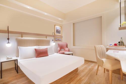 Ένα ή περισσότερα κρεβάτια σε δωμάτιο στο Lemon Tree Hotel, Delhi Airport