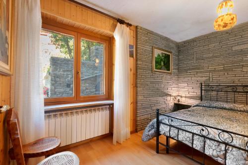 Ένα ή περισσότερα κρεβάτια σε δωμάτιο στο Casa Vacanza Famiglia Belli