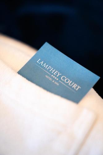 a blue card sitting on top of a napkin at Best Western Lamphey Court Hotel and Spa in Lamphey