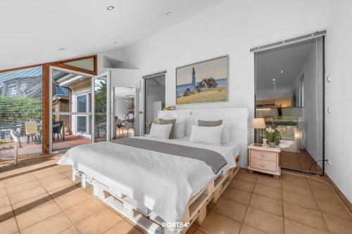 Ένα ή περισσότερα κρεβάτια σε δωμάτιο στο Ferienwohnung Strandperle Lutterbek