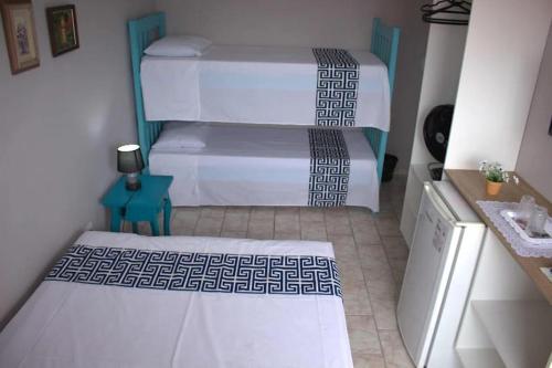 Cama o camas de una habitación en Pousada Solar das Ondas