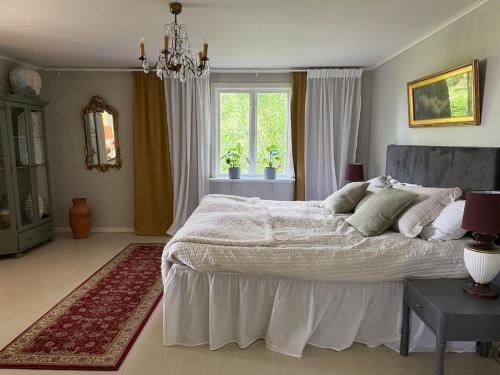 Ένα ή περισσότερα κρεβάτια σε δωμάτιο στο Spacious house in rural idyll