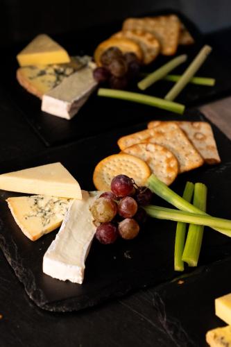a bunch of different types of cheese and vegetables at Best Western Lamphey Court Hotel and Spa in Lamphey
