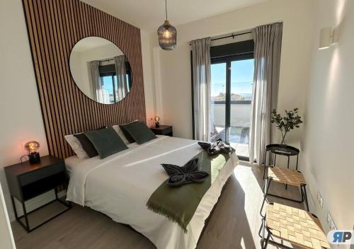 Postel nebo postele na pokoji v ubytování 001 Orizon con terraza y vista al mar