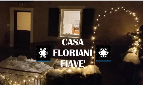 a sign that says casa floriana have on a house at Casa Floriani Fiavè-Comano Terme pink in Fiavè