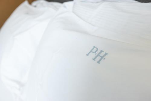 a white shirt with the rip written on it at Piazzi House in Sondrio