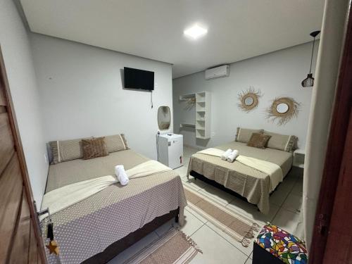 Postel nebo postele na pokoji v ubytování Casa de Temporada Estrela de Alter