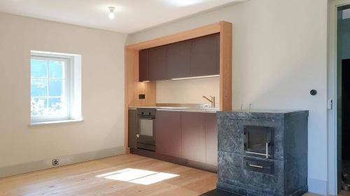 a kitchen with a stove and a counter top at Eggwald in Wassen