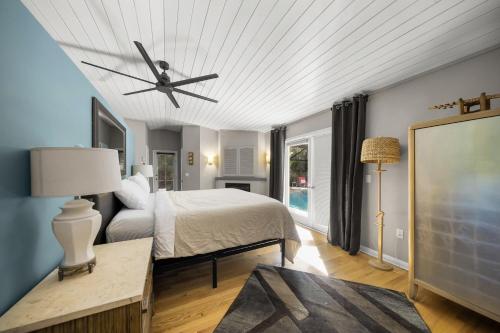 a bedroom with a bed and a ceiling fan at The Shaded Sanctuary in Southgate