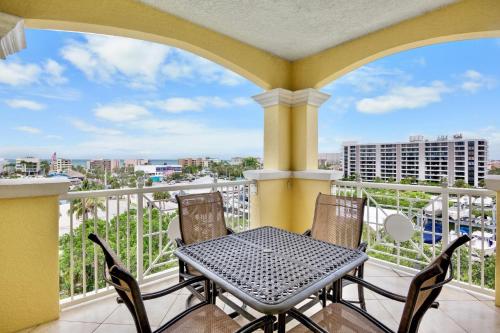 a table and chairs on a balcony with a view at Penthouse Paradise in Siesta Key