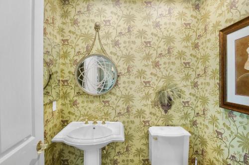 a bathroom with a sink and a mirror at Penthouse Paradise in Siesta Key