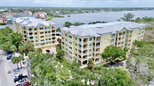 an aerial view of a building with a river in the background at Penthouse Paradise in Siesta Key