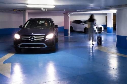 a car is parked in a parking garage at Jardins Eiffel in Paris