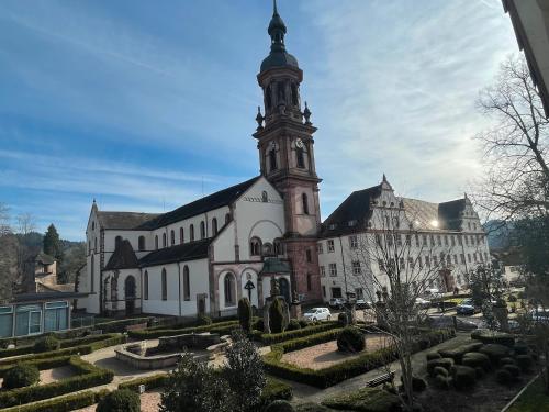 a large church with a tower on top of it at Ferienwohnungen St Marien in Gengenbach