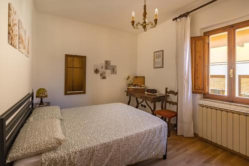 Postel nebo postele na pokoji v ubytování La casa dei nonni Checco e Corinna