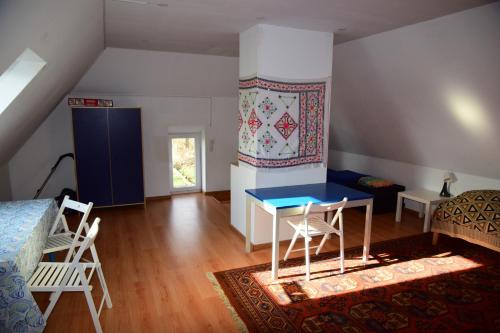 a room with a blue table and chairs in it at Haus Gorch Fock in Tremt
