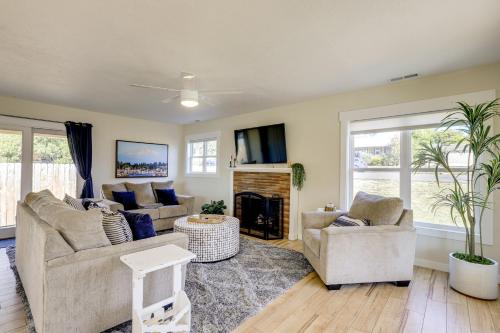 a living room with two couches and a fireplace at Walk to Dtwn Camas! Updated Home with Game Room in Camas