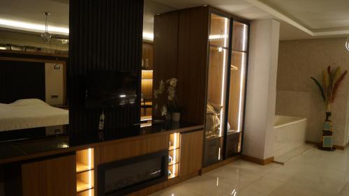 Ένα ή περισσότερα κρεβάτια σε δωμάτιο στο Kentpark Exclusive Hotel