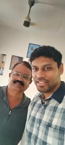 two men are standing next to each other at Gerards Home stay Fortkochi in Cochin