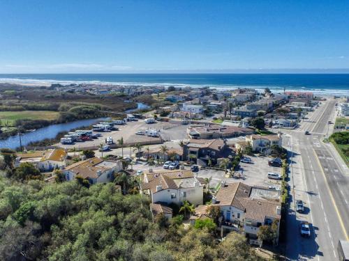 an aerial view of a town with the ocean at Pacific Plaza #511 - Oceano Escape - 1BdrmUp-K-QSofa in Oceano