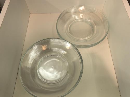 two glass bowls sitting on top of a table at Summer Cozy Studio Room in Perai