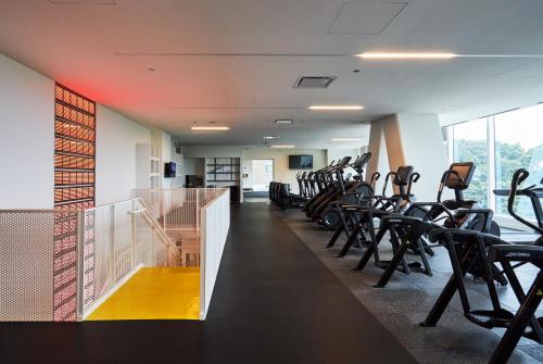 a gym with a row of chairs and a treadmill at Lux Apts with Lake Views and Top Amenities in Chicago