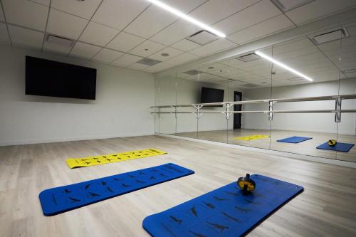 a gym with blue mats on the floor in a room at Lux Apts with Lake Views and Top Amenities in Chicago